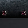 Ladies Round Cut Rhodelite Color Stud Earrings / 14 Kt W - Anderson Jewelers 